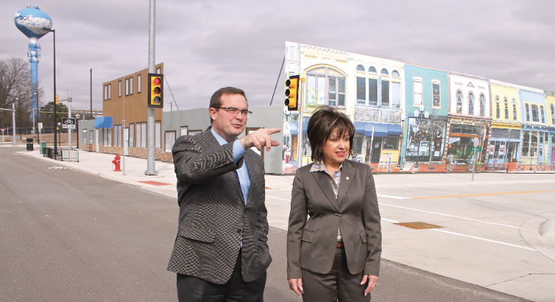 Dr. James R. Sayer, director of the University of Michigan Transportation Research Institute, shows WCC President Dr. Rose B. Bellanca around the streets of Mcity, a 32-acre simulated urban environment used to test connected and autonomous vehicle technology. Photo by Lynn Monson