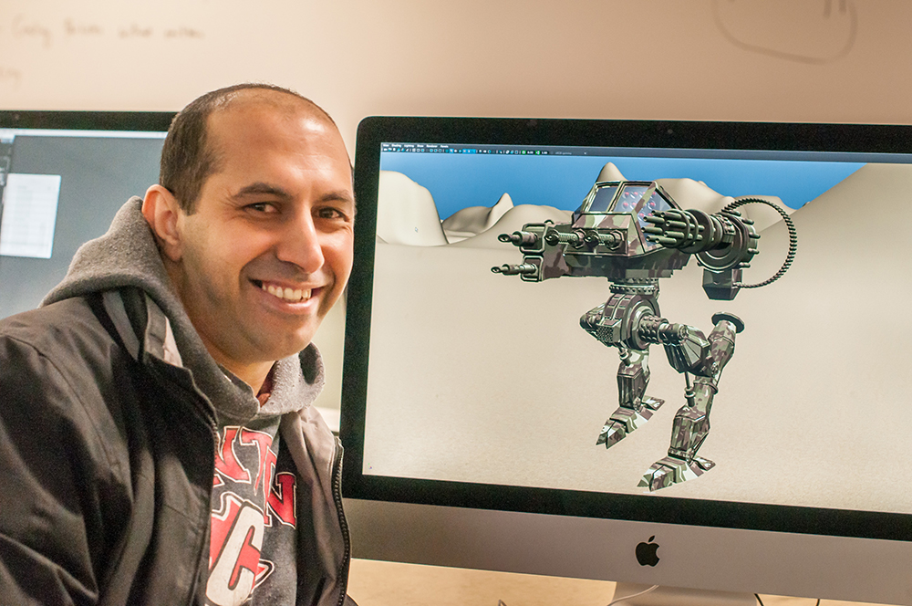 3-D Animation student Moh Kahla shows off one of his creations. | Photo by Jessica Bibbee