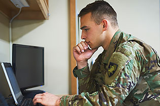 military student at computer