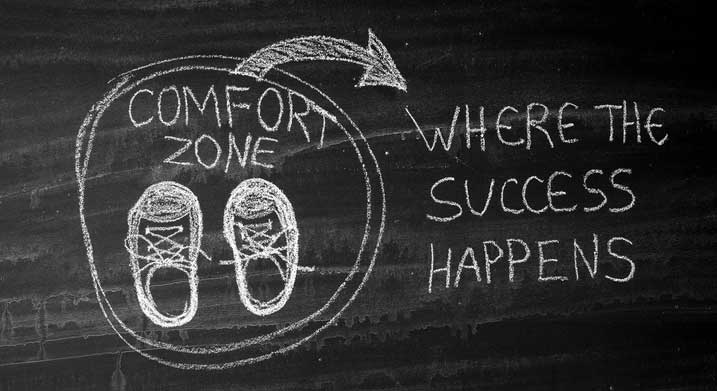 drawing on blackboard - arrow pointing outside of comfort zone